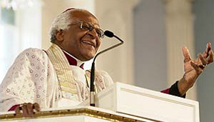 Desmond Tutu says true happiness comes from volunteering. joining the Peace Corps 